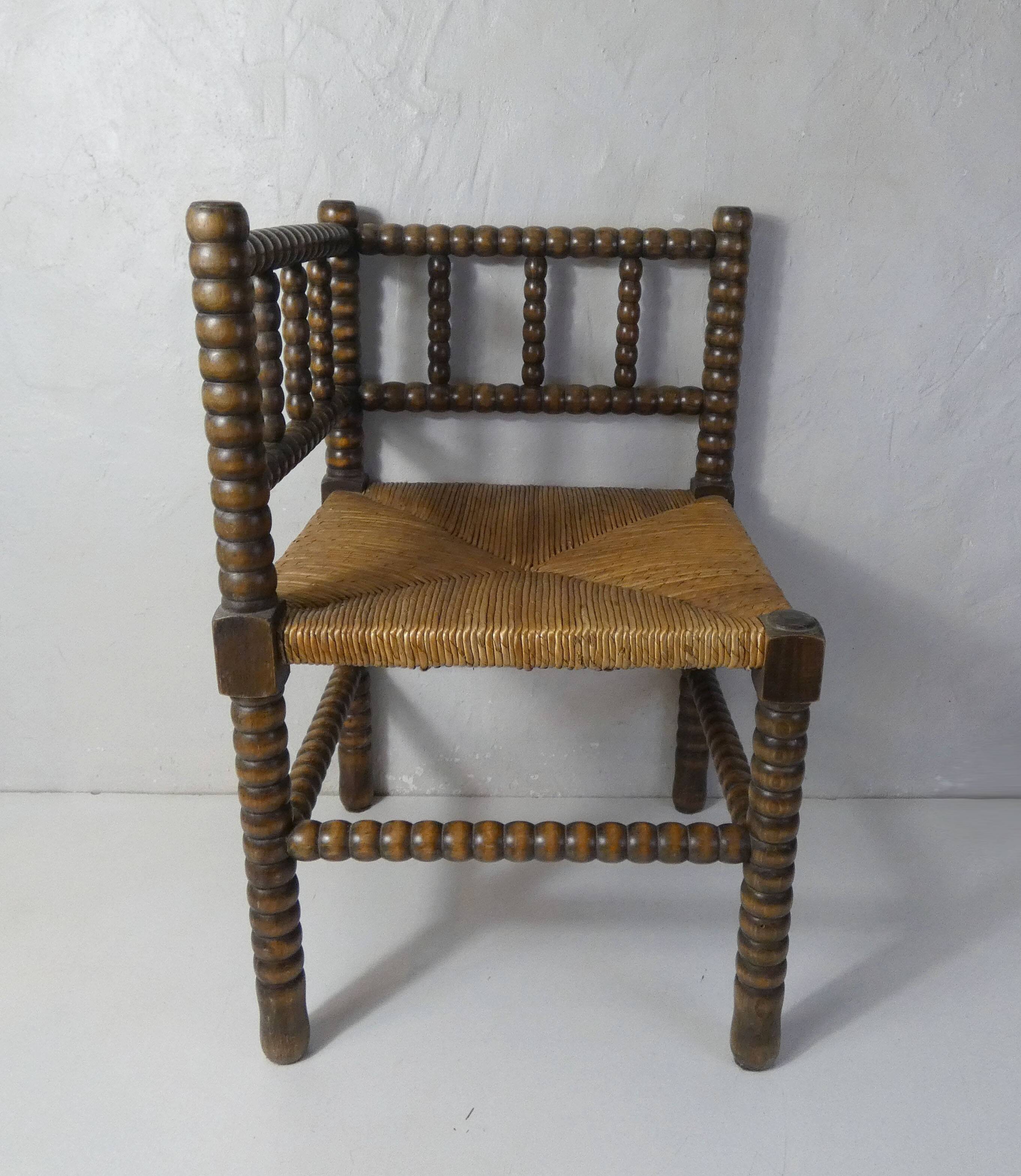 Old corner armchair beaded wood paillé