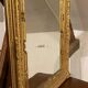 Wooden mirror with gilded stucco