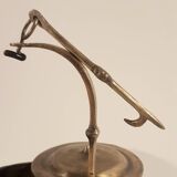 Old oil lamp in golden brass to hang