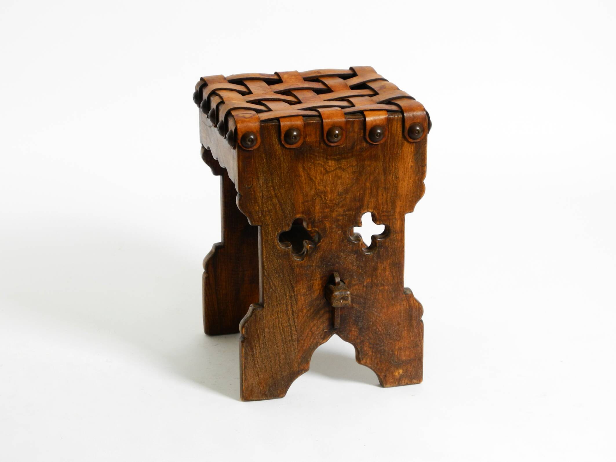 Beautiful 1940s oak stool with a seat made of leather straps