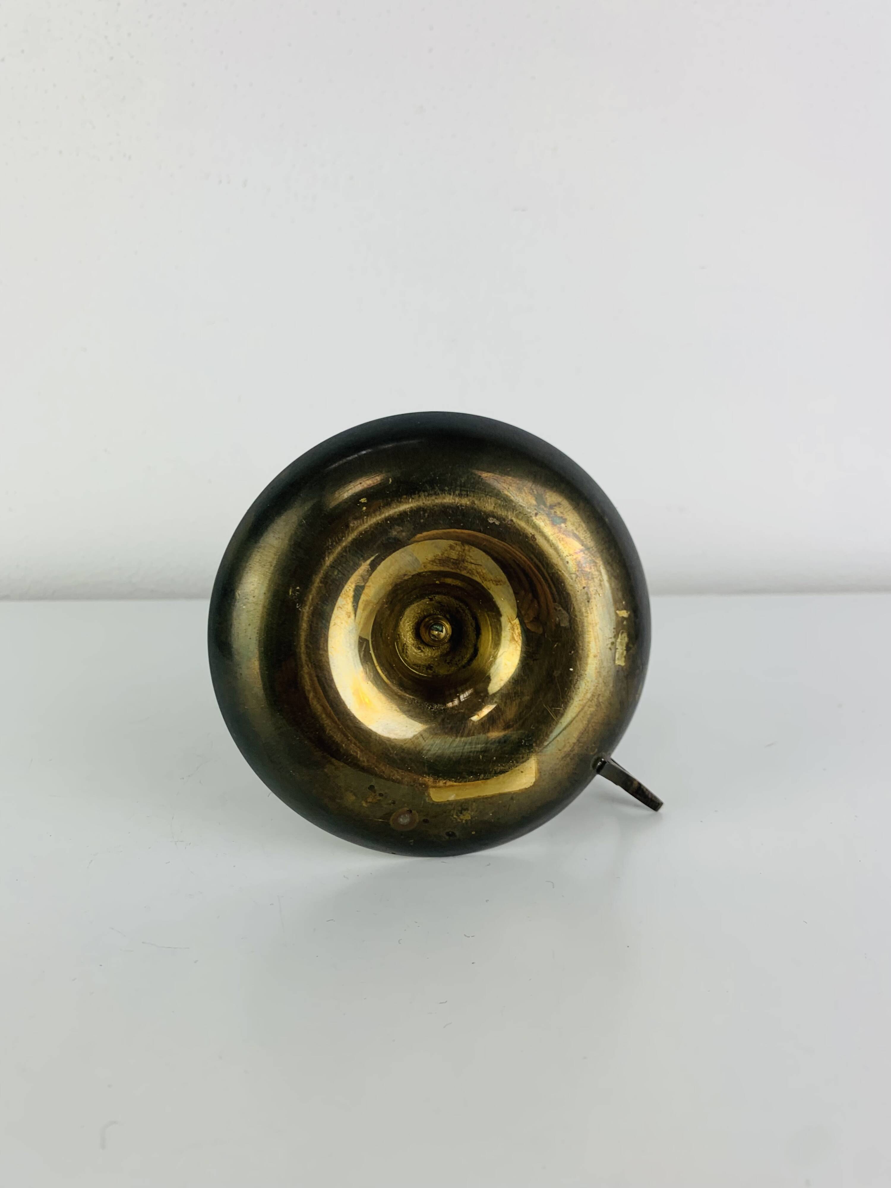 Vintage brass candlestick that raises and lowers.