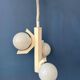 Mid-century white suspension with a bony design and opaline glass shade.