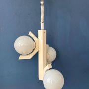 Mid-century white suspension with a bony design and opaline glass shade.