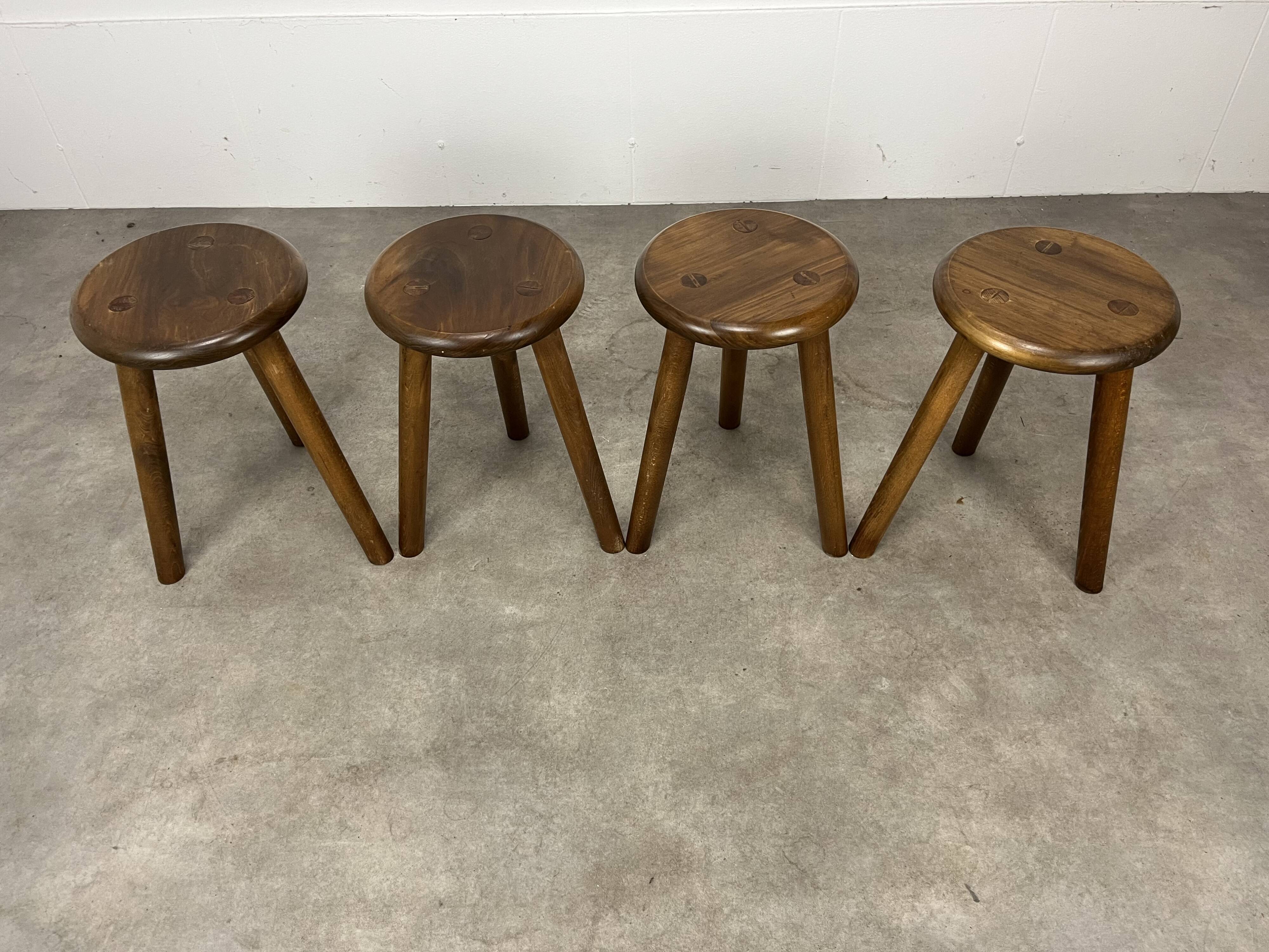 4 wooden tripod stools