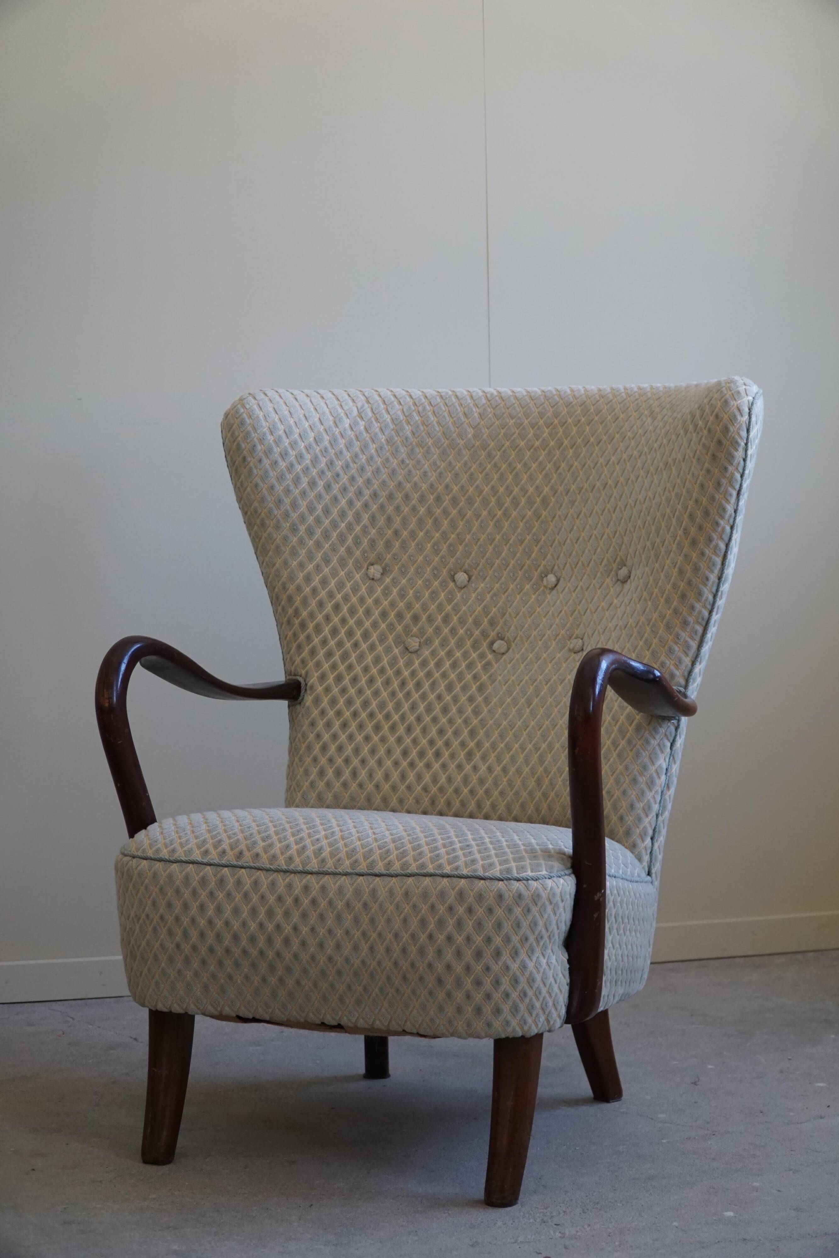 Slagelse Møbelfabrik, modern Danish lounge armchairs with beech footrests, 1960s.