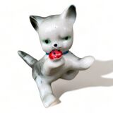 Little ceramic cat playing with a playful ladybug plays gray and white decoration
