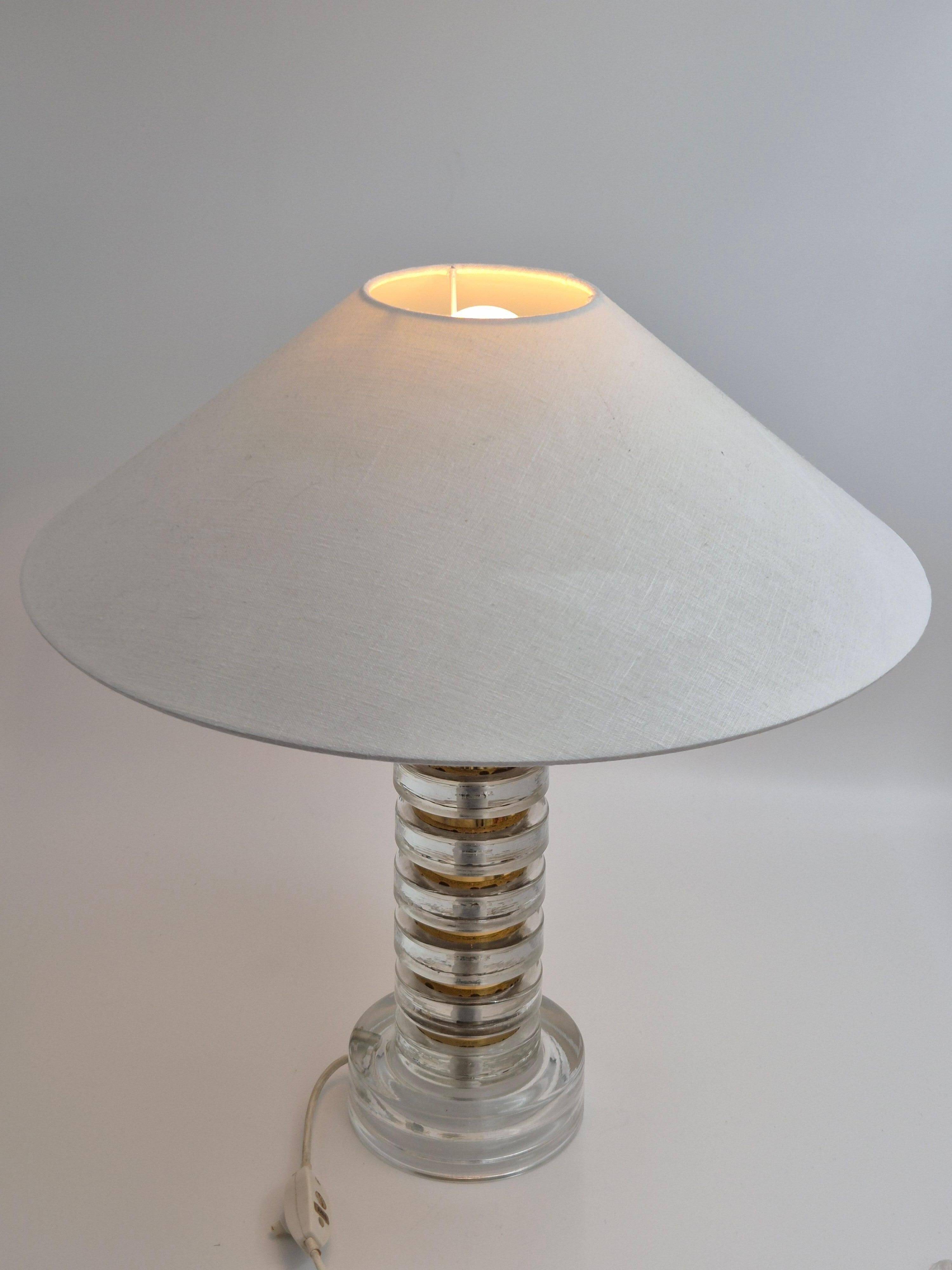 The Modern Scandinavian / Midcentury Modern table lamp with Orrefors glass and brass.