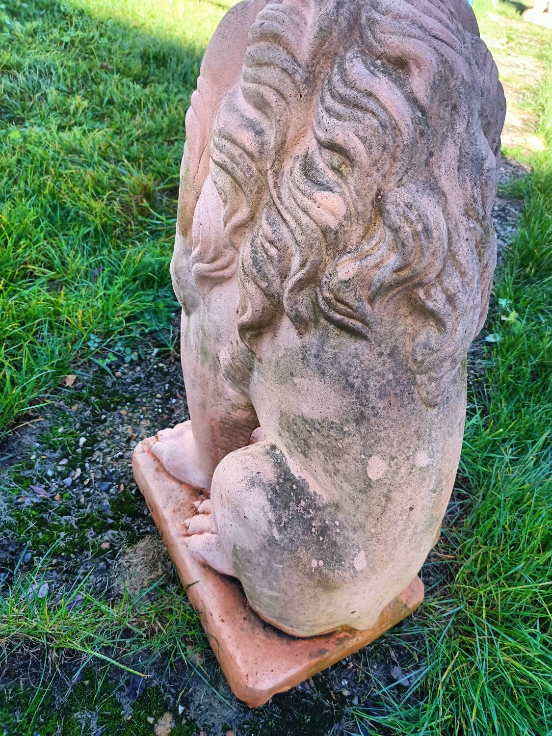 Pair of old terracotta garden lions