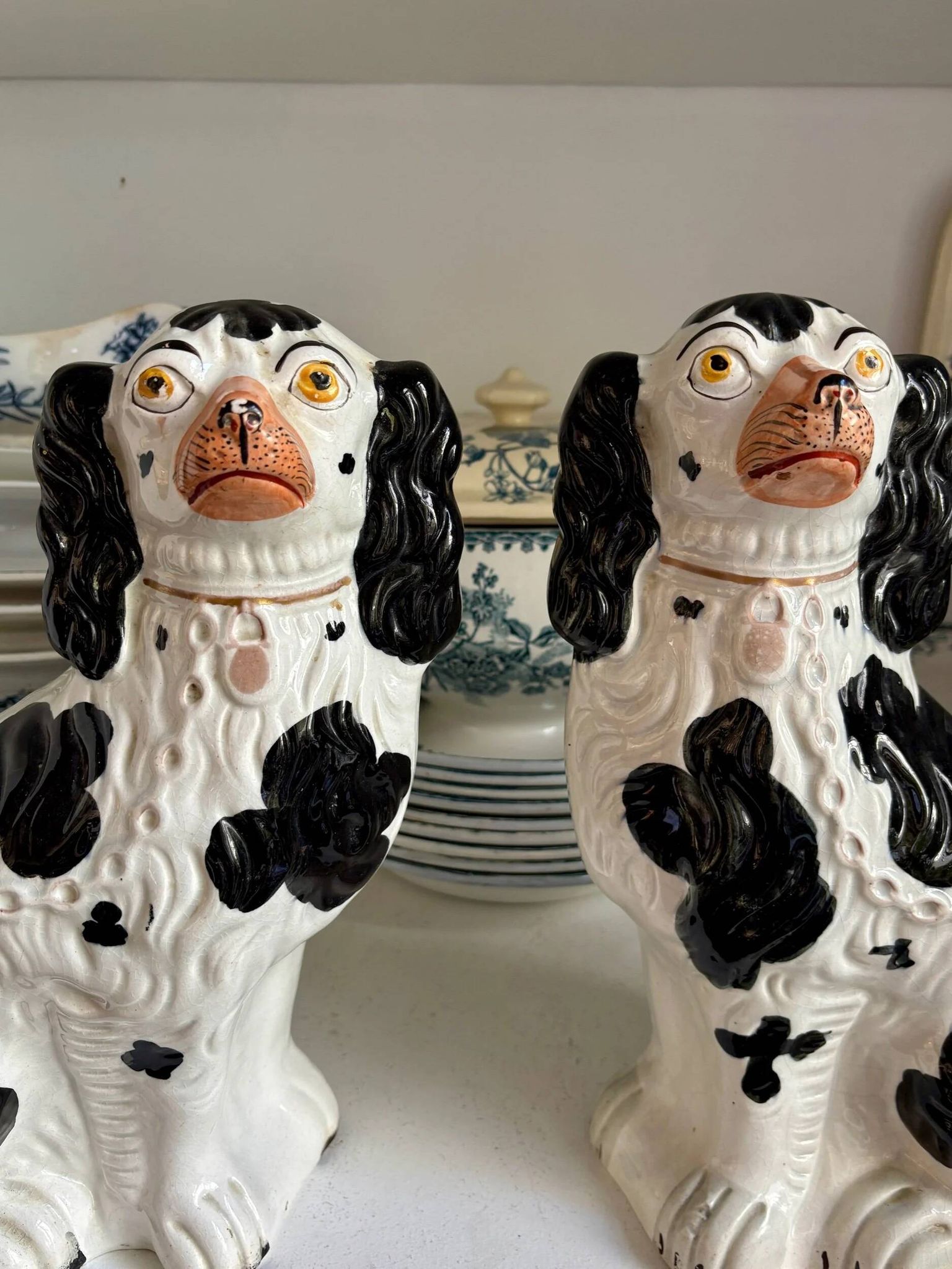 Pair of black Cavalier King Charles dogs in Staffordshire pottery, 19th century.