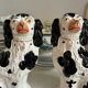 Pair of black Cavalier King Charles dogs in Staffordshire pottery, 19th century.