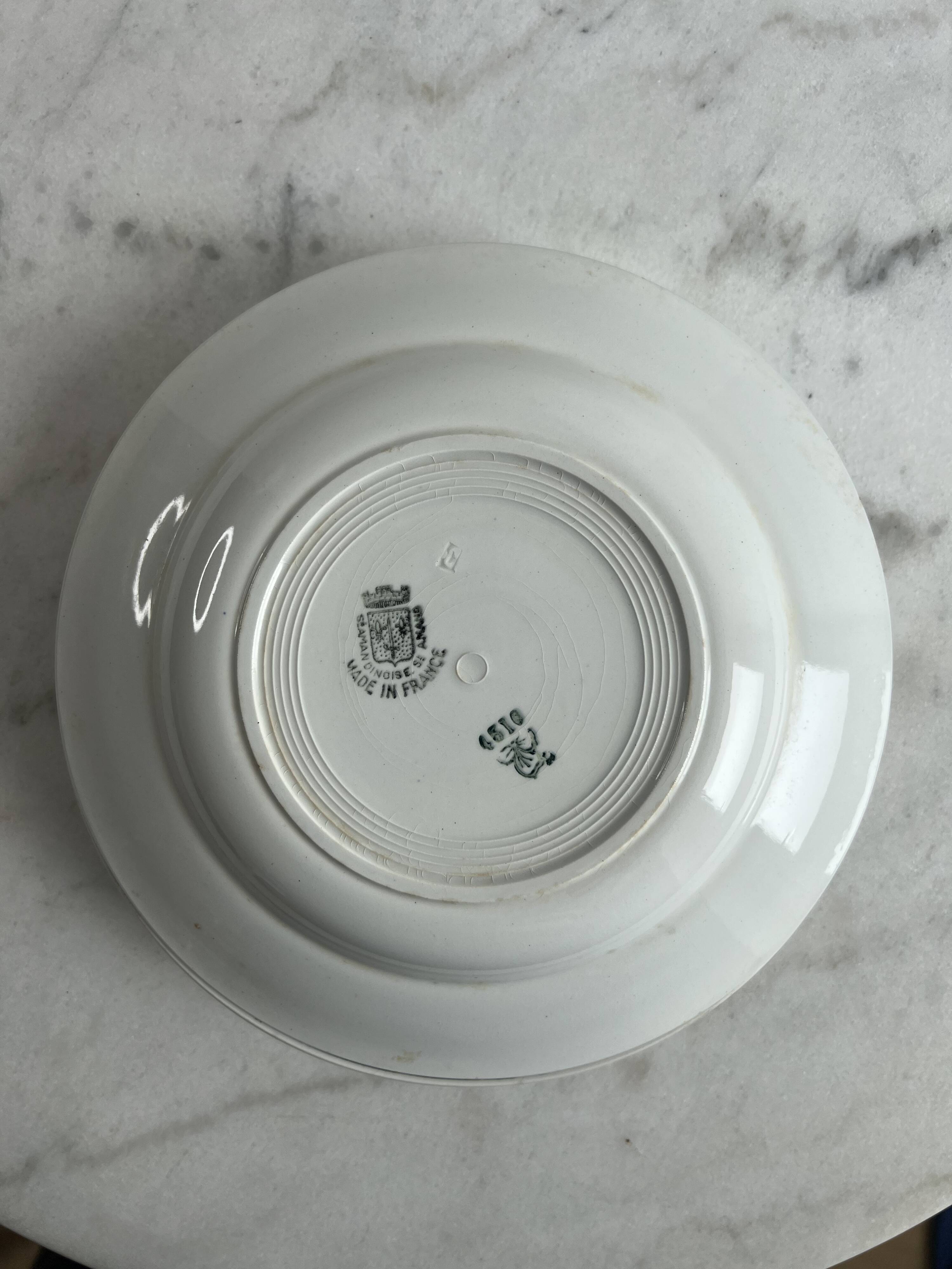 Set of two green frilled deep plates from Saint-Amand.