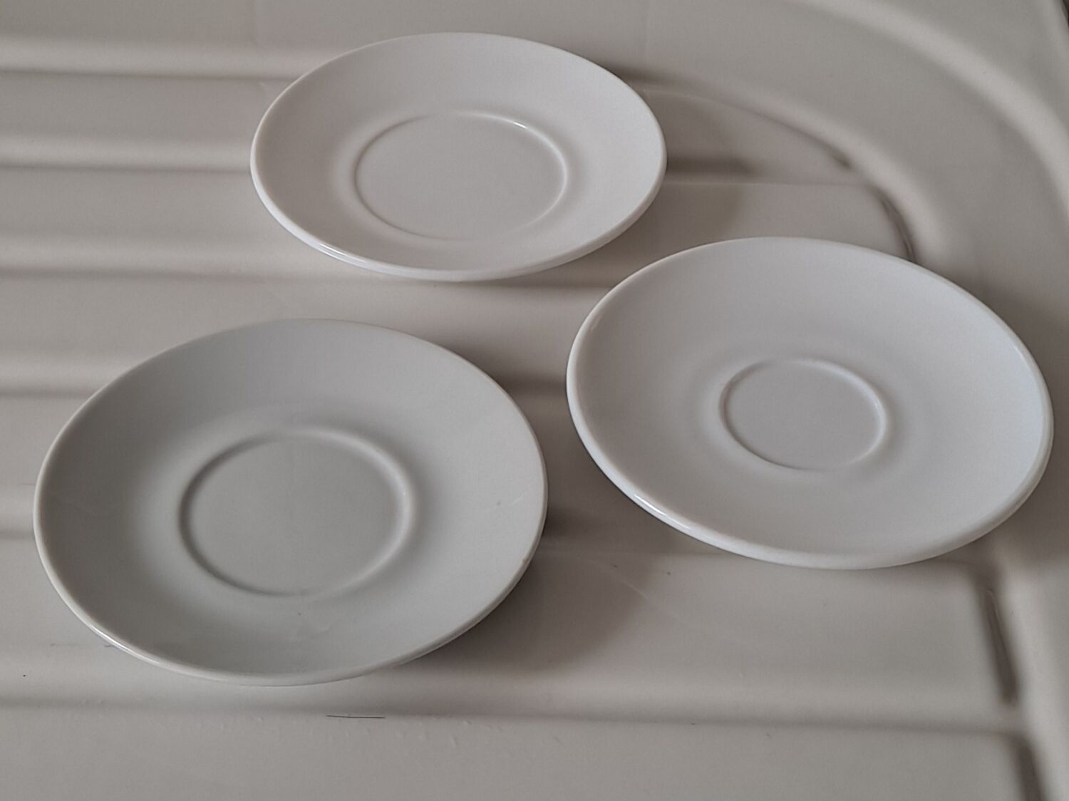 Trio of mismatched white cups