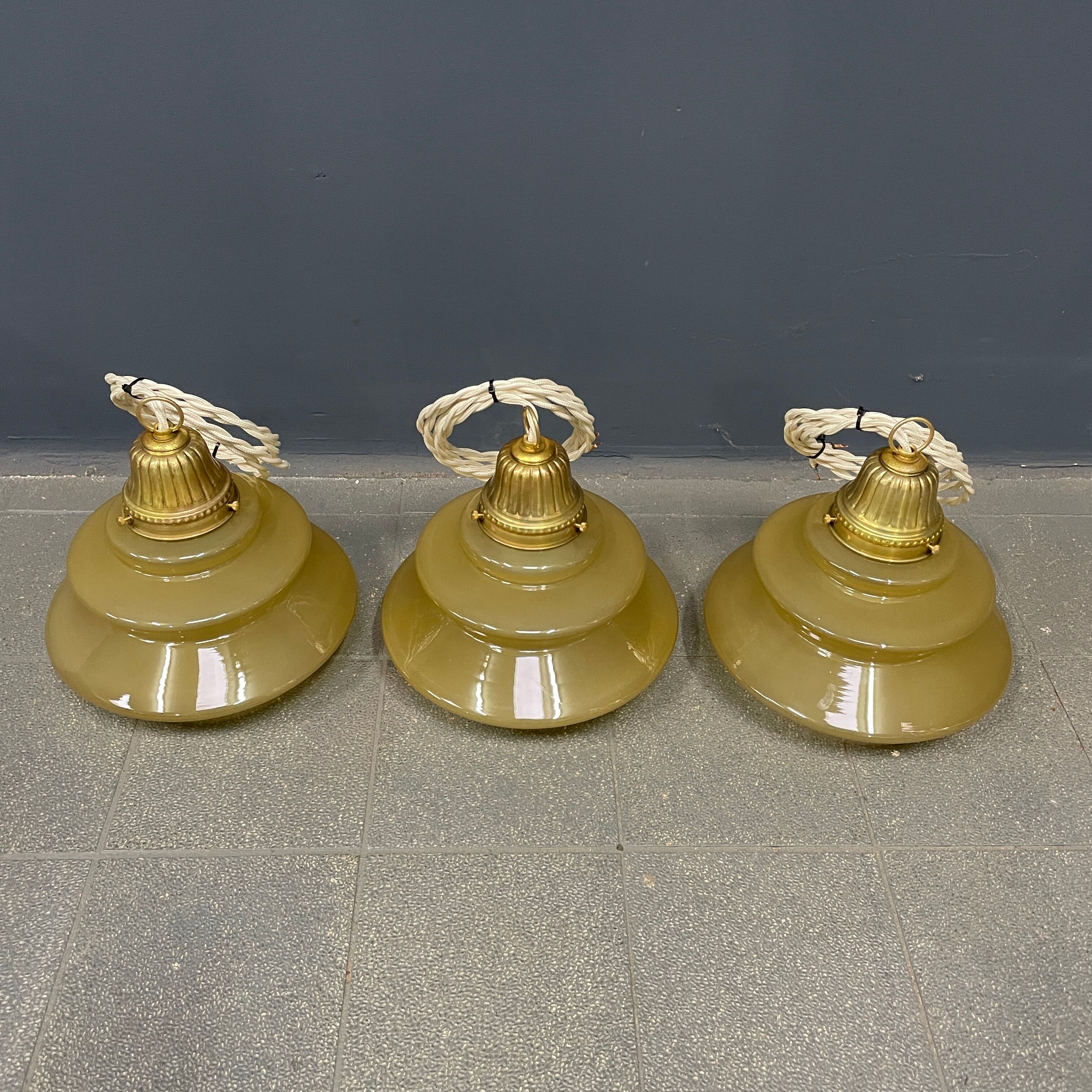 Vintage ocher glass hanging lamps with brass gallery