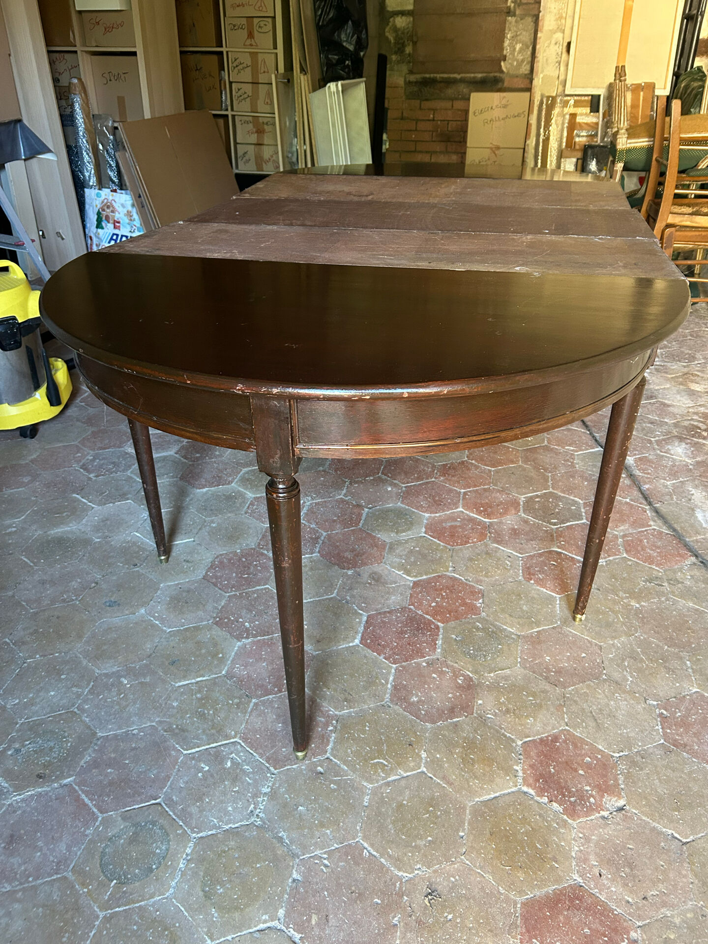 Half-moon table in mahogany, Louis XVI style.