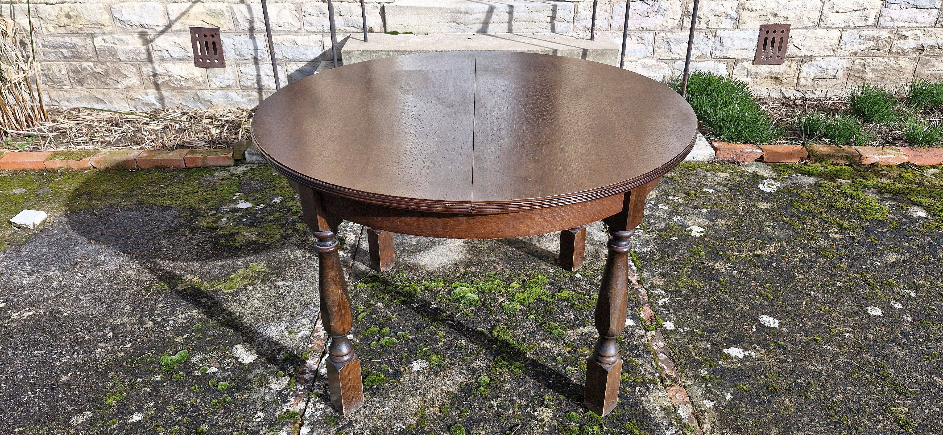 Round wooden table with 1 integrated extension + 6 wooden and fabric chairs