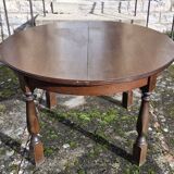 Round wooden table with 1 integrated extension + 6 wooden and fabric chairs