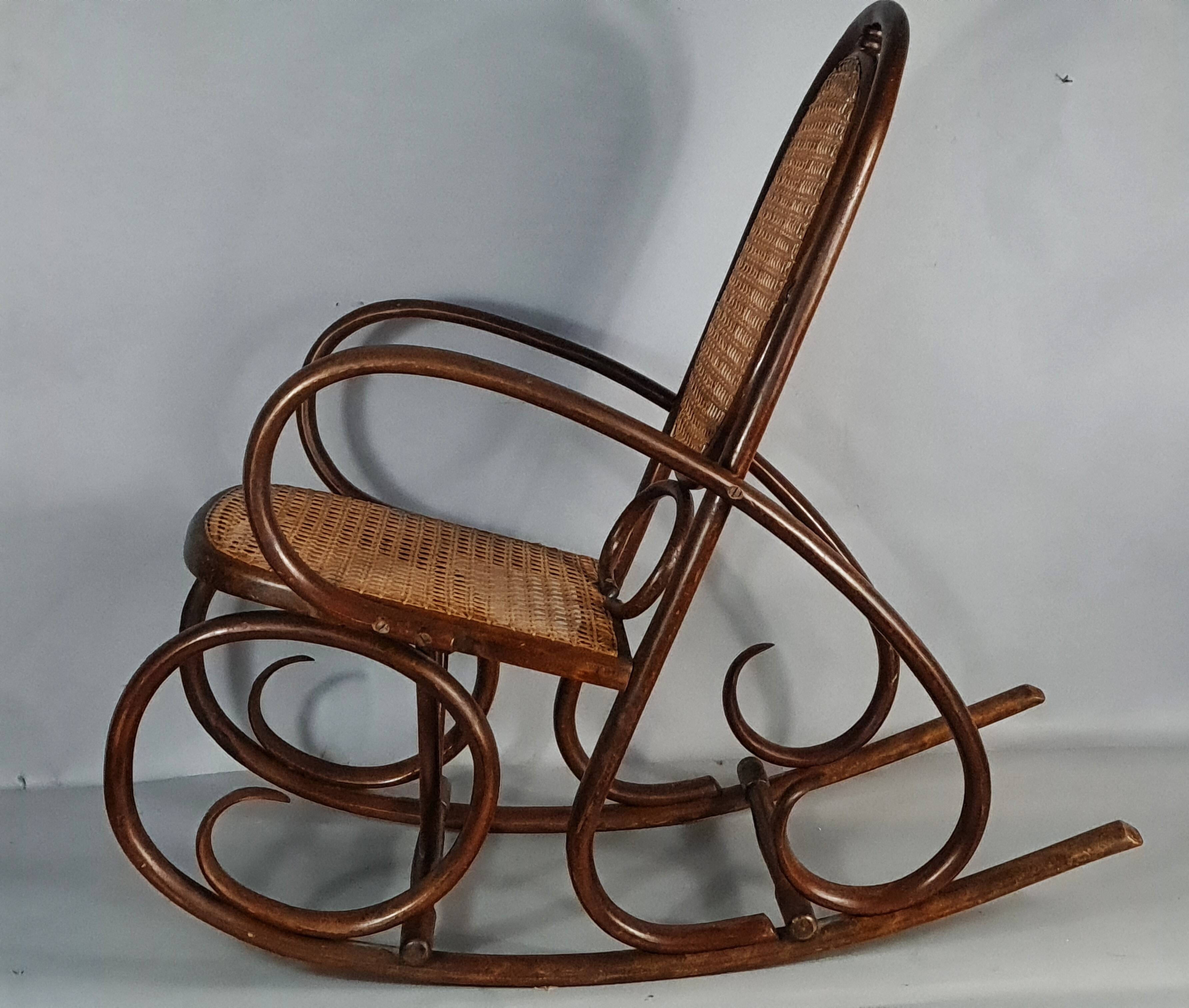 Vintage curved wood rocking chair for children with recent caning model D912.