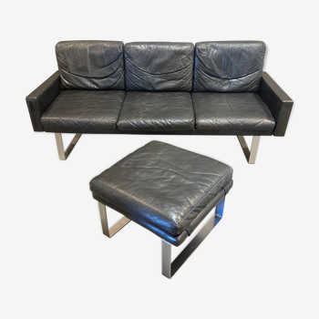 Black leather sofa and its ottoman 1960