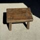 Small stool, rectangular solid teak side table with curved legs.