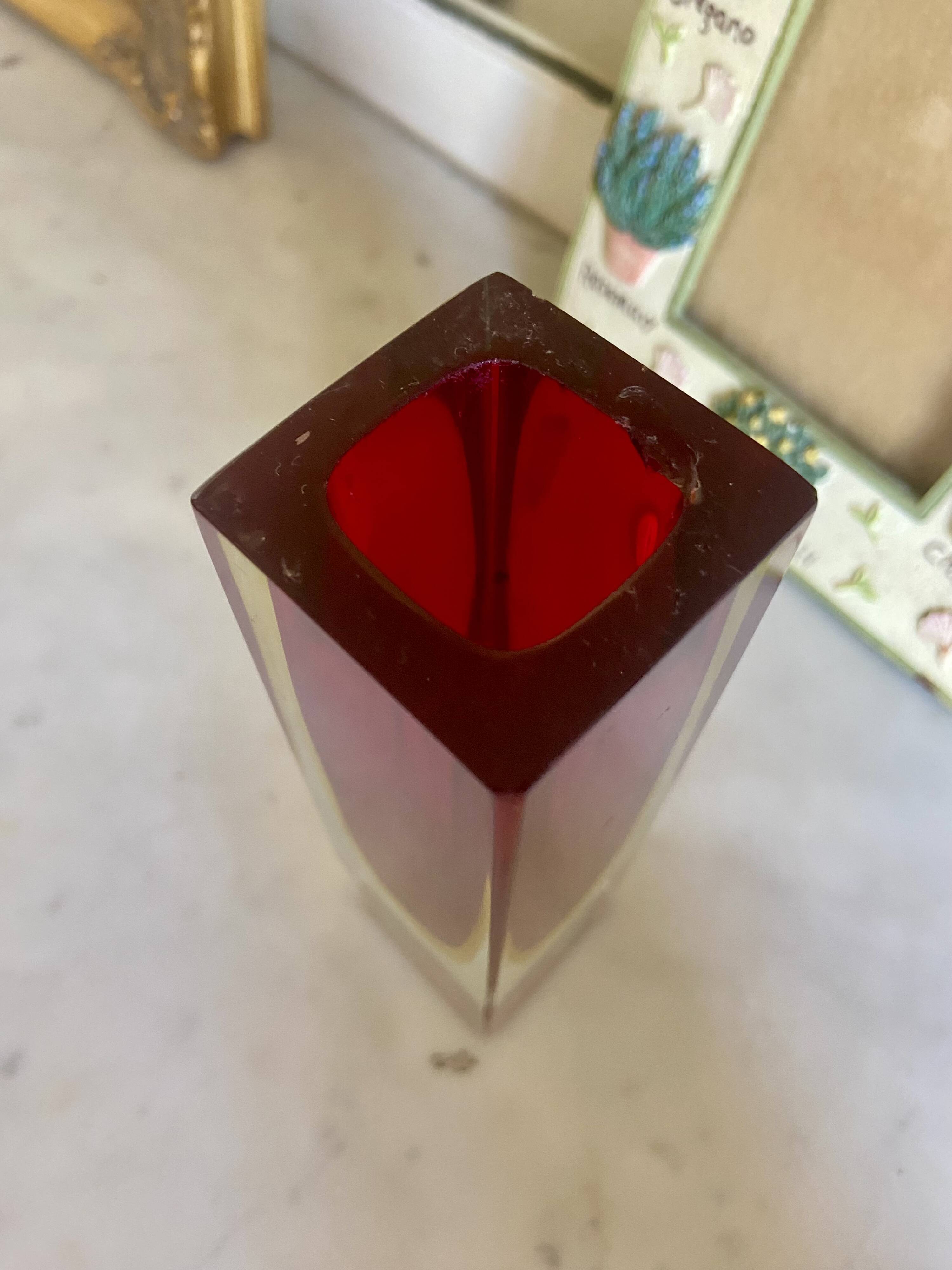 Small red vase made of Murano glass.