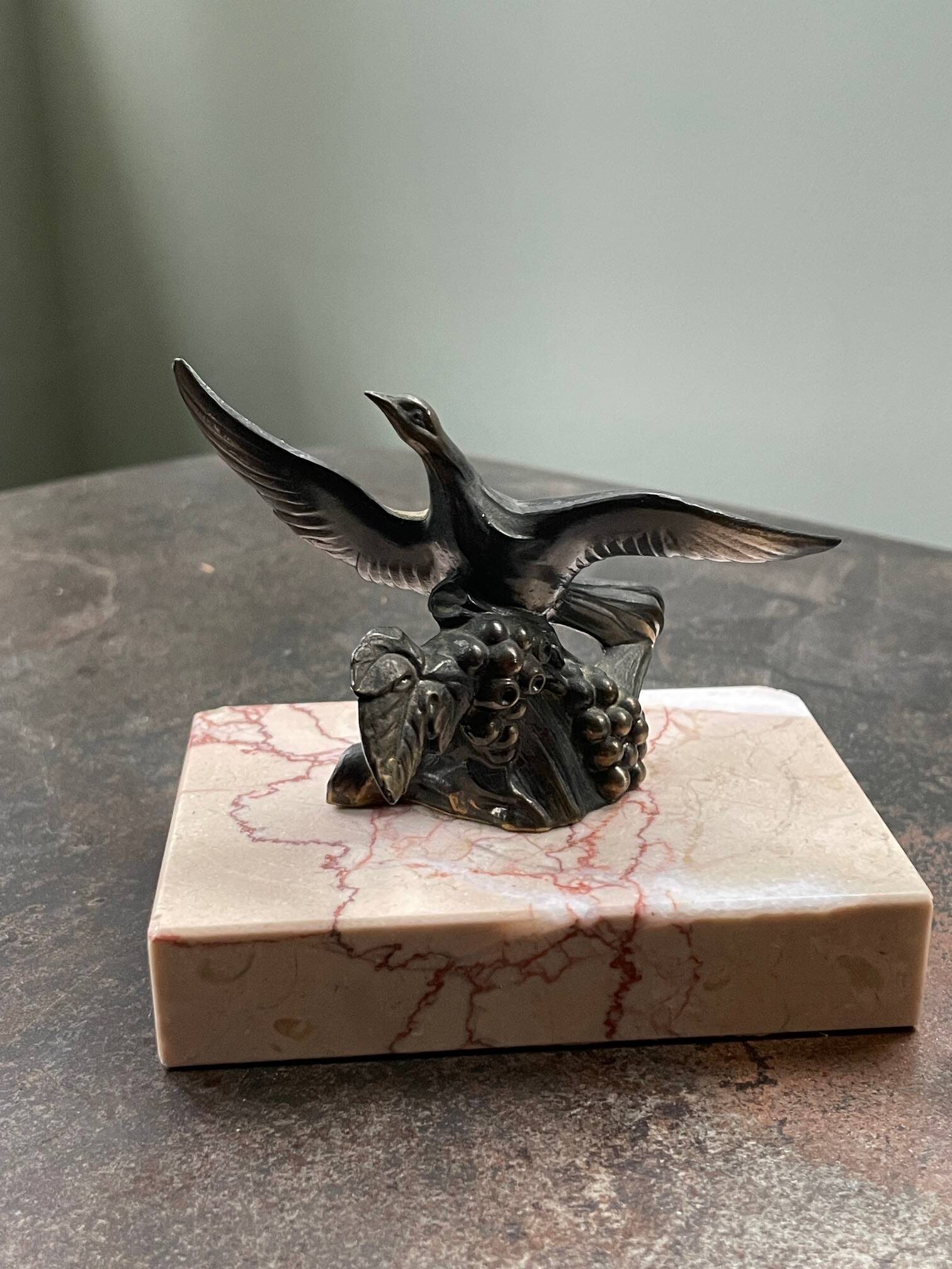 Pair of marble bookends with bronze birds