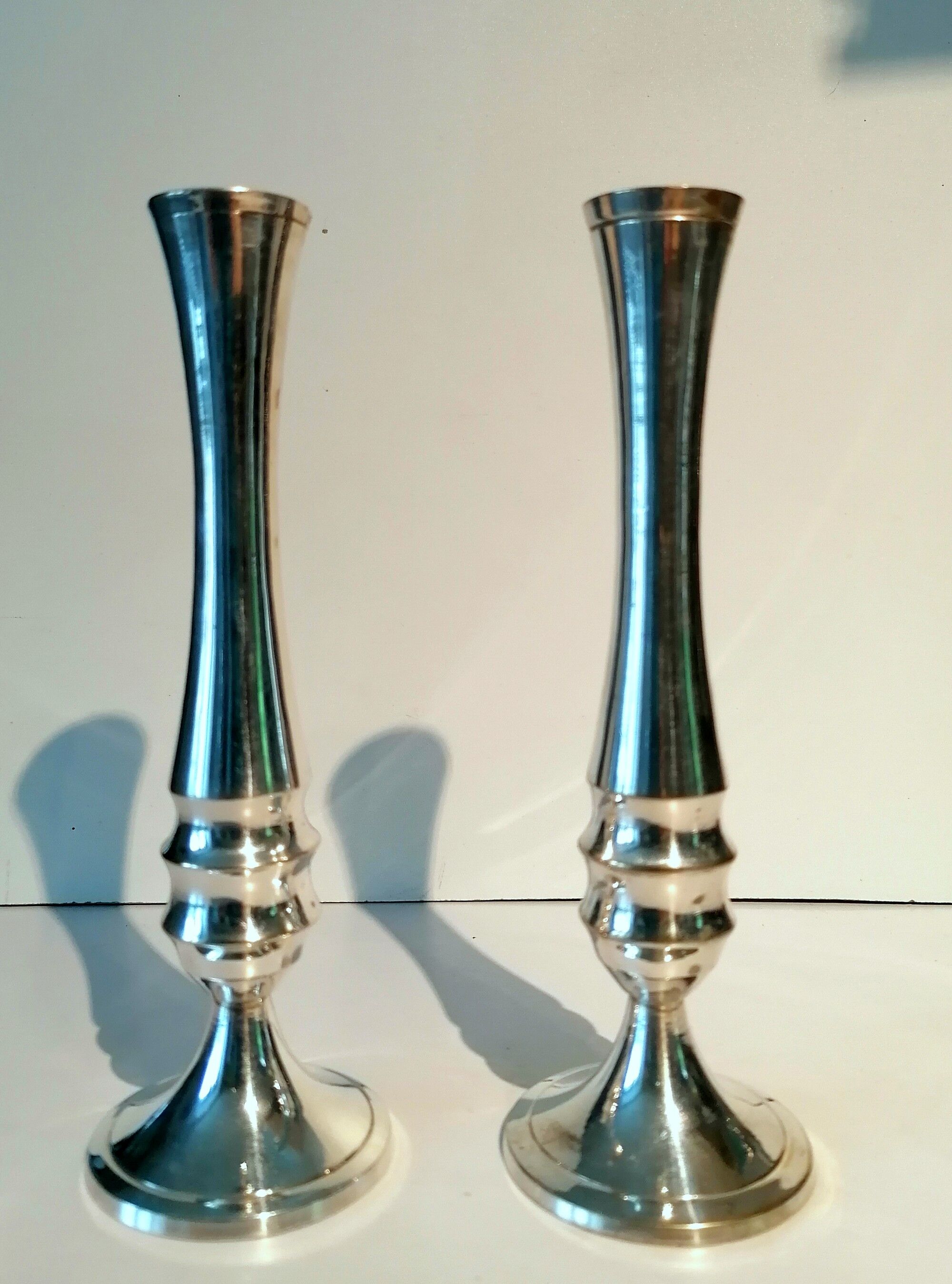 Pair of silver metal candle holders