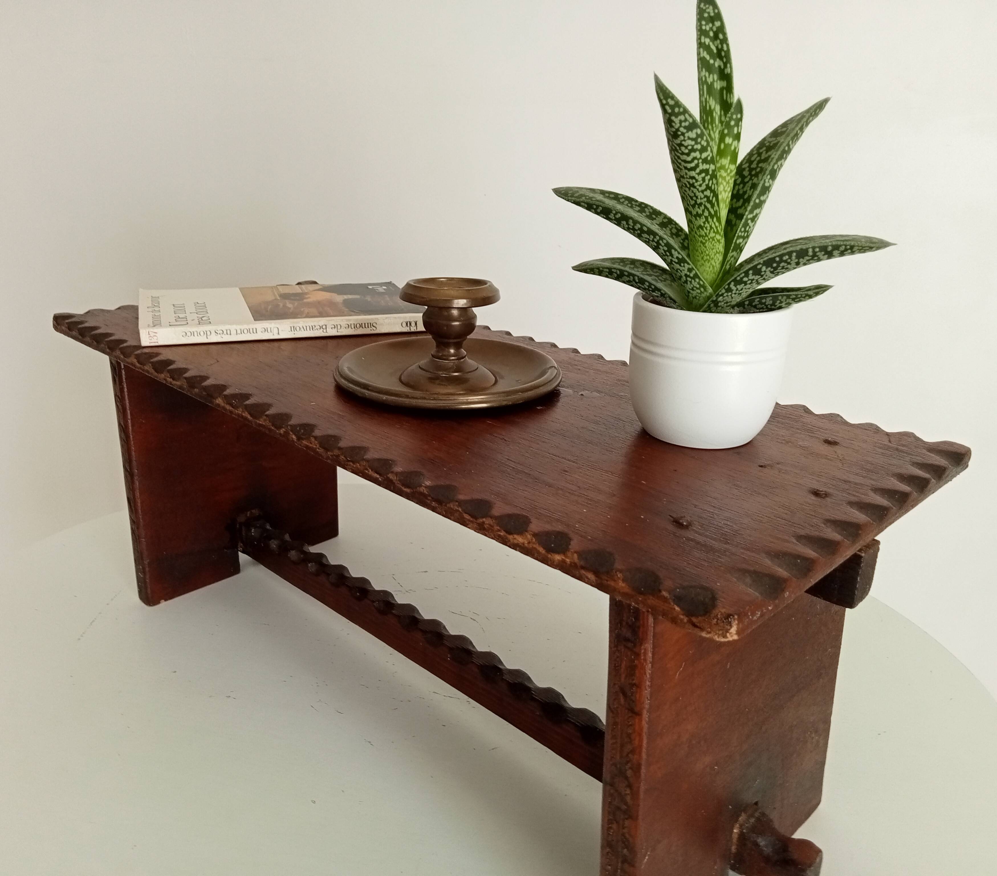 Low brutalist stool in the style of Charles Dudouyt.