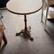 Cast iron base side table with a stone-effect top.