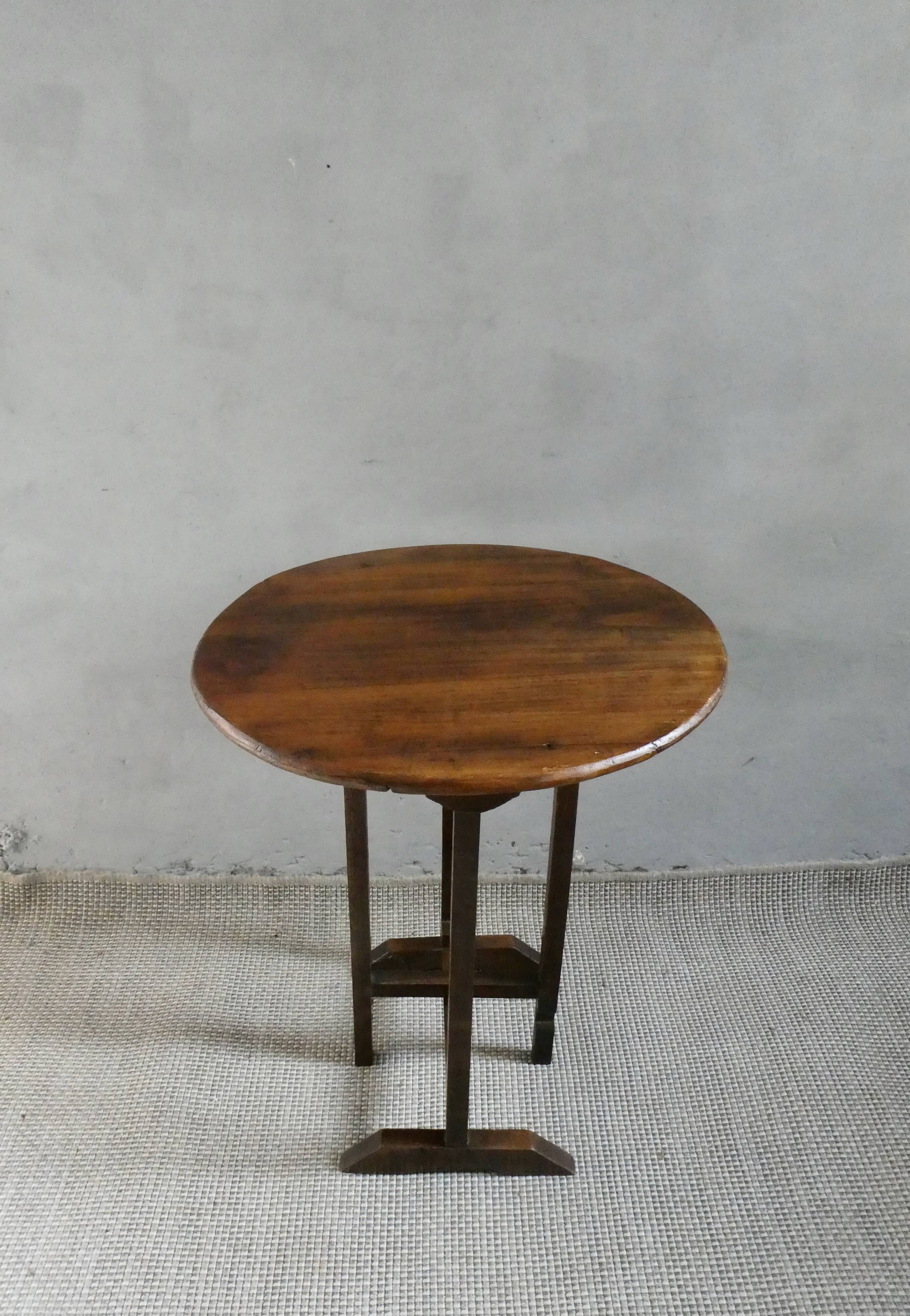 Small table known as a winemaker's table.