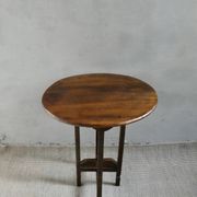 Small table known as a winemaker's table.