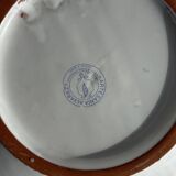 Artesania Alvarez Spanish plate in terracotta with blue plant motif.
