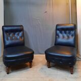 Pair of upholstered low chairs without arms