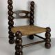 Chaise basse en bois tourné dans le style de Charles Dudouyt, France, années 1950