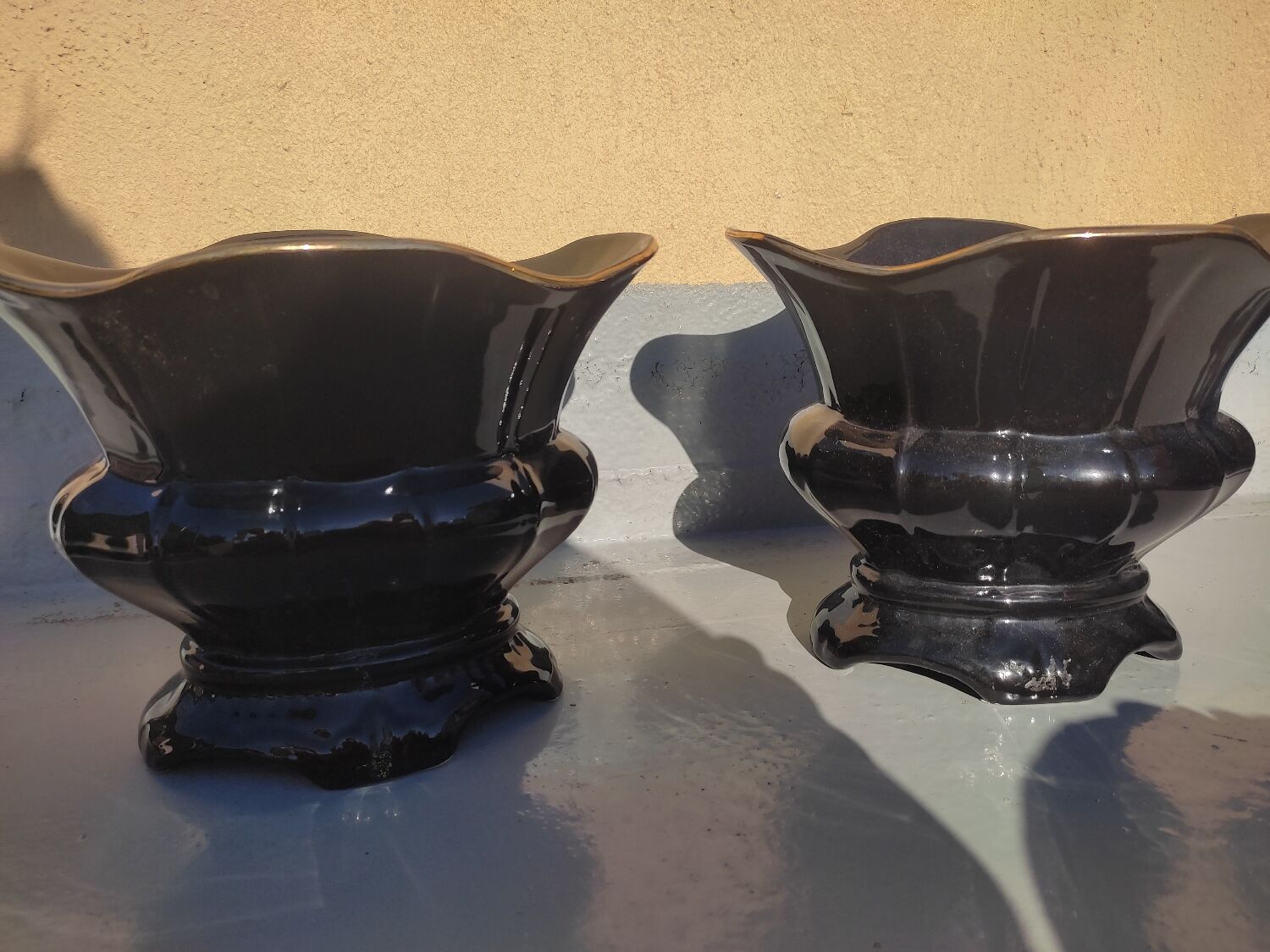 Pair of black earthenware planters