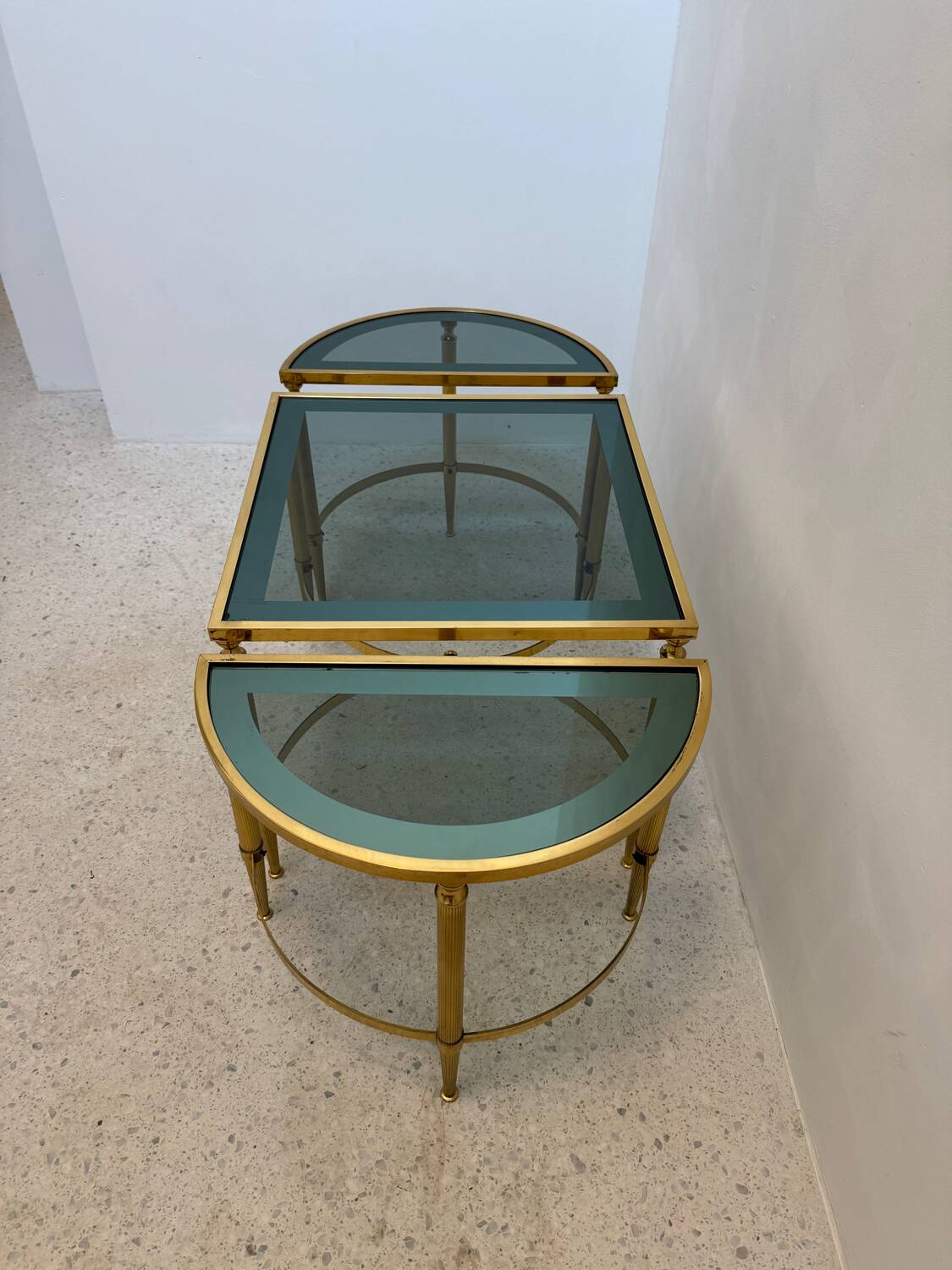 Neo classic coffee table in brass and smoked glass