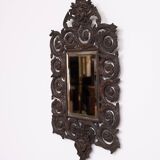 Miroir mural antique en bronze coulé représentant une tête de femme