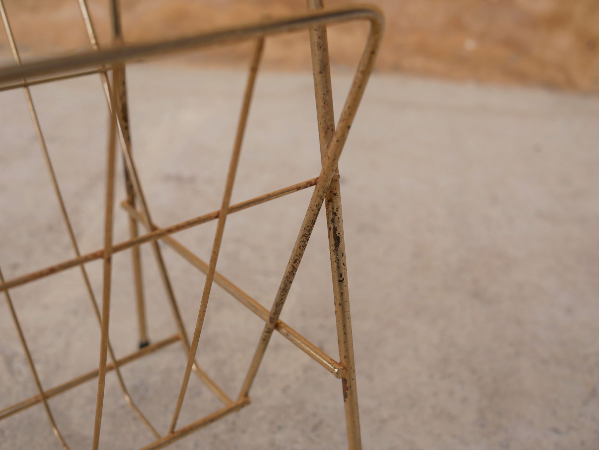 Vintage gold metal magazine rack