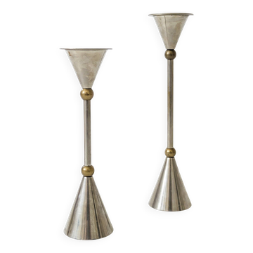Pair of postmodern candlesticks in Memphis style made of steel and brass.