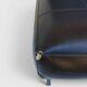 Modernist armchair in black faux leather and metal – 1960s