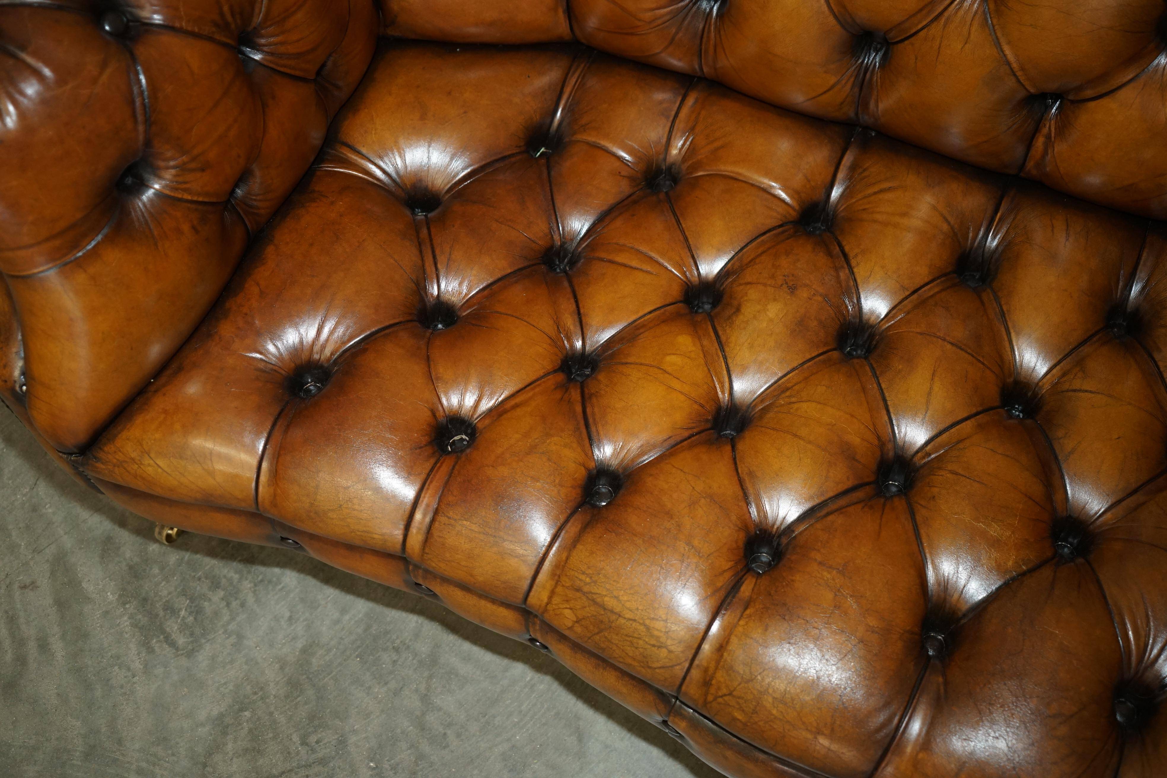 Vintage Chesterfield serpentine luxury sofa in restored leather