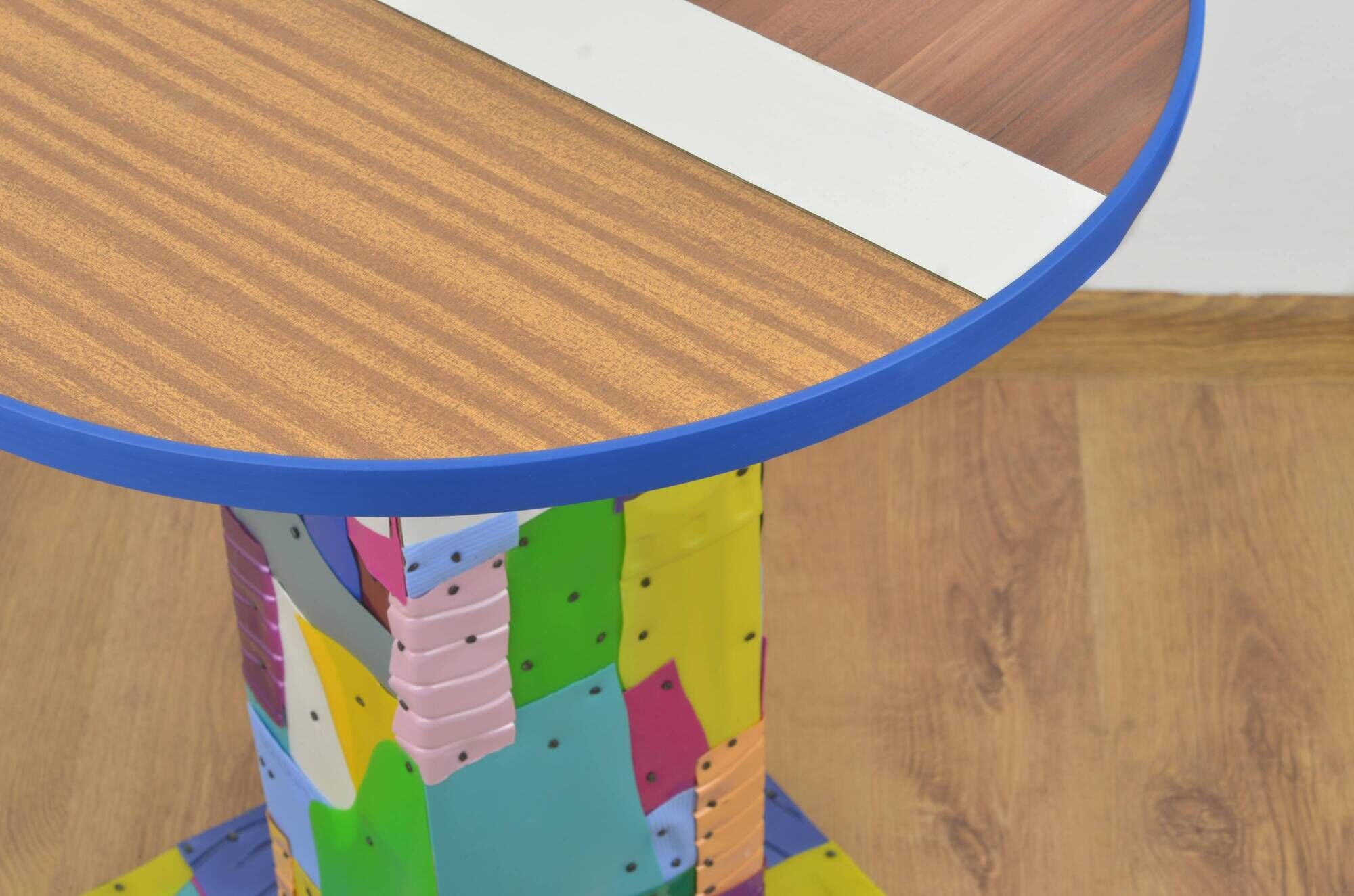 Handmade table made from recycled materials, colourful, abstract.