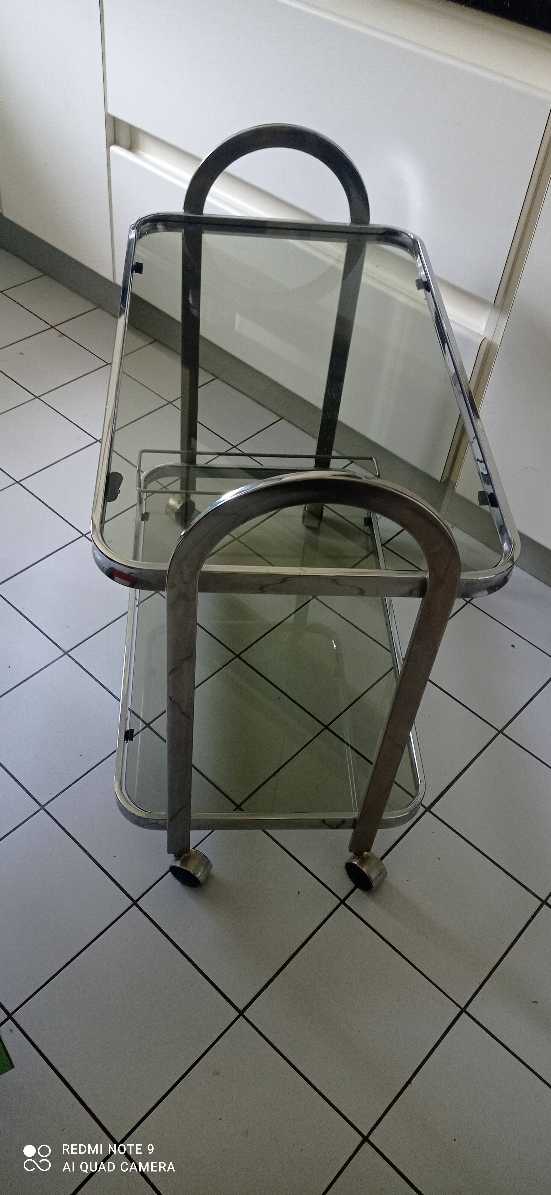 Vintage rolling trolley in smoked glass