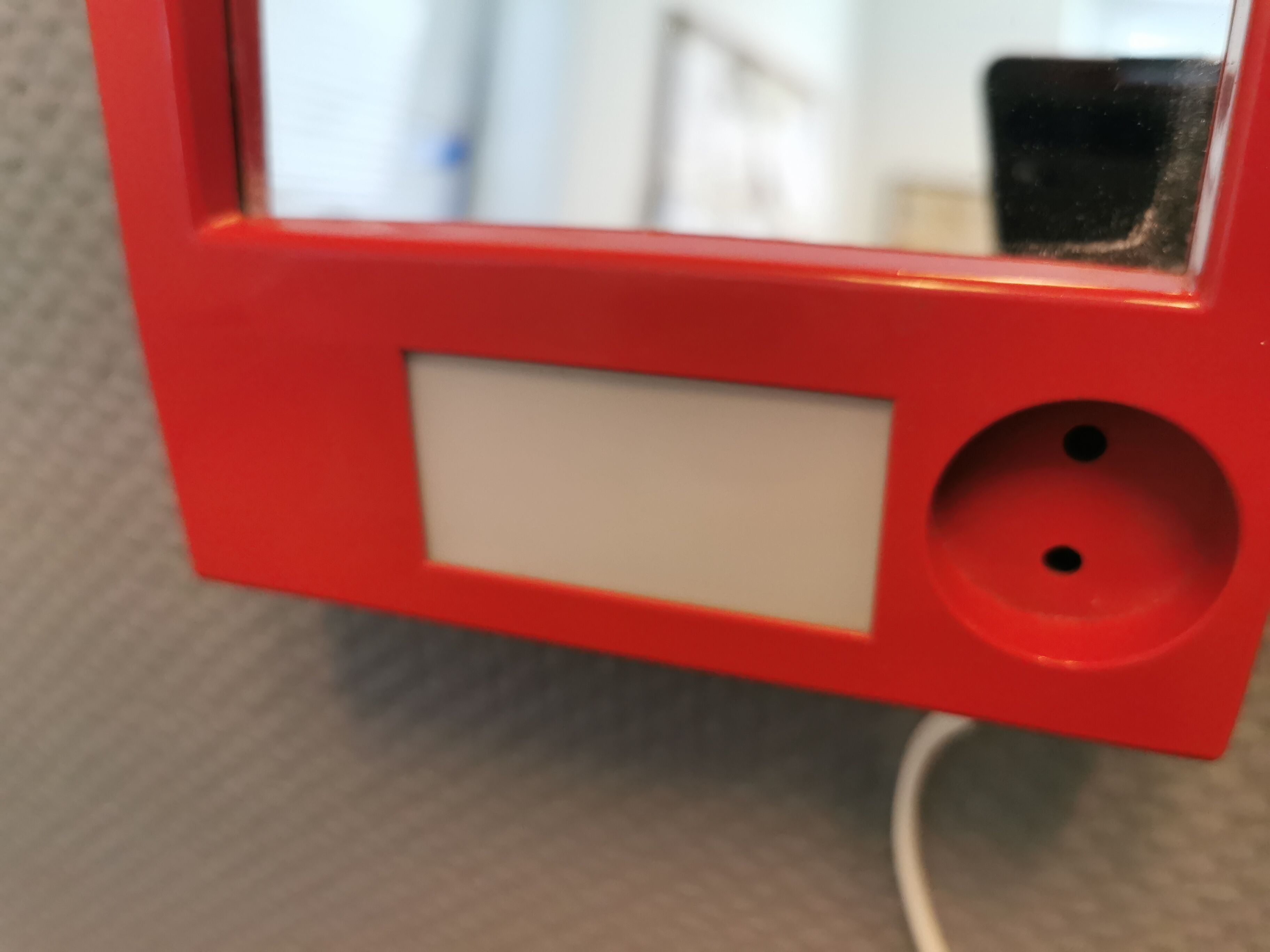 Red danish make up mirror with light and power plug from the 1970