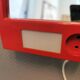 Red danish make up mirror with light and power plug from the 1970