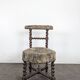 Napoleon III smoking chair in twisted blackened wood with foliage upholstery.