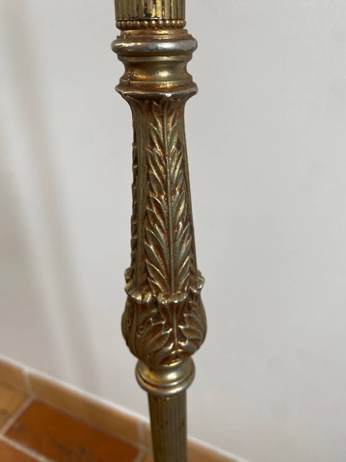 Gold-colored iron floor lamp