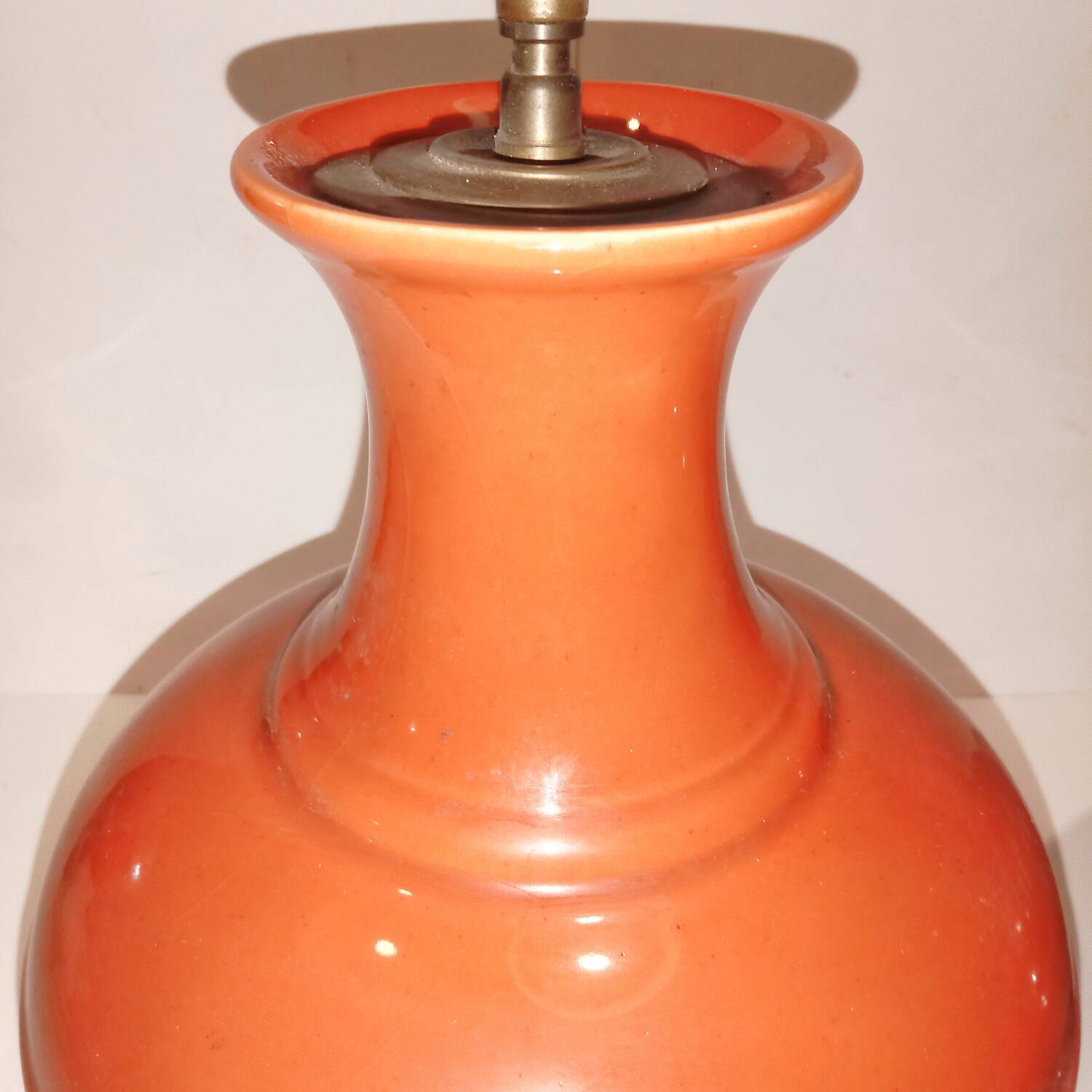 Pair of ceramic lamp bases in the shape of orange gourds.