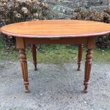 Table ovale ancienne en cerisier pieds parapluie