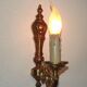 Simple wall sconce in classic Empire style in vintage French bronze.