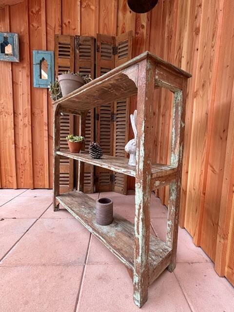 Teak shelves with a green patina